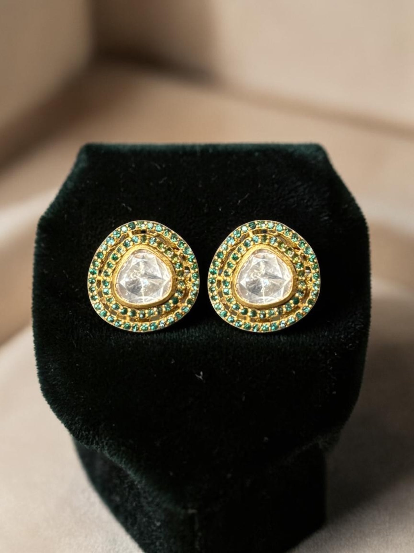 Silver traditional earrings with emeralds