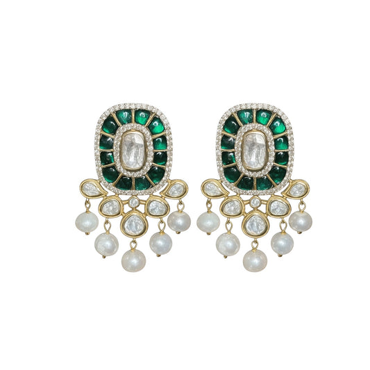 Pair of earrings with green gemstones and pearl-like beads on a white background